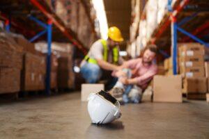 A construction worker falls with an injury and wonders when to get a lawyer for a work injury in Long Island, NY