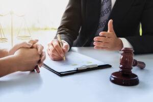 A client consulting with a lawyer. Learn about how long you have to file a truck accident lawsuit in NY.
