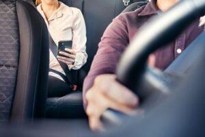 A woman using a rideshare service. Learn about the legal options for rideshare sexual assault victims in Long Island, NY.
