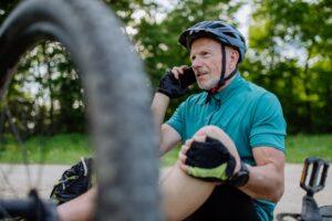 A man asking on the phone whether he can sue if he was partially at fault for a bicycle accident in New York.