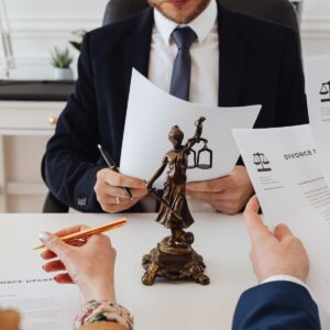 Injured New York driver reviewing car accident documents with a personal injury lawyer, highlighting why legal help increases settlement outcomes.