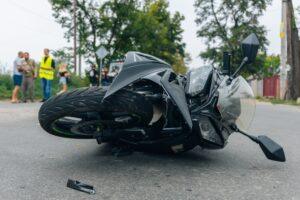 The aftermath of a motorcycle accident, where the rider is left wondering if they can sue after a motorcycle accident if they weren’t wearing a helmet in NY.