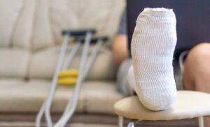 Man Injured sitting on a sofa