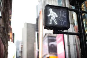Crosswalk OK sign on a Manhattan traffic light. What are my legal rights as a pedestrian in New York?