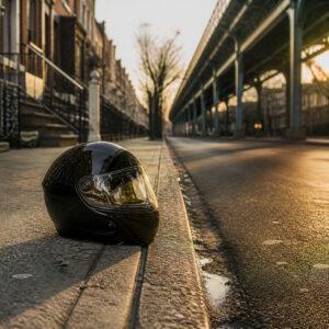 Motorcycle helmet on a Queens street curb after a motorcycle accident