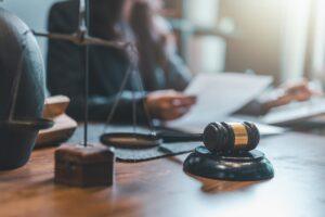 An attorney who handles car accidents sitting at a desk with paperwork on top.